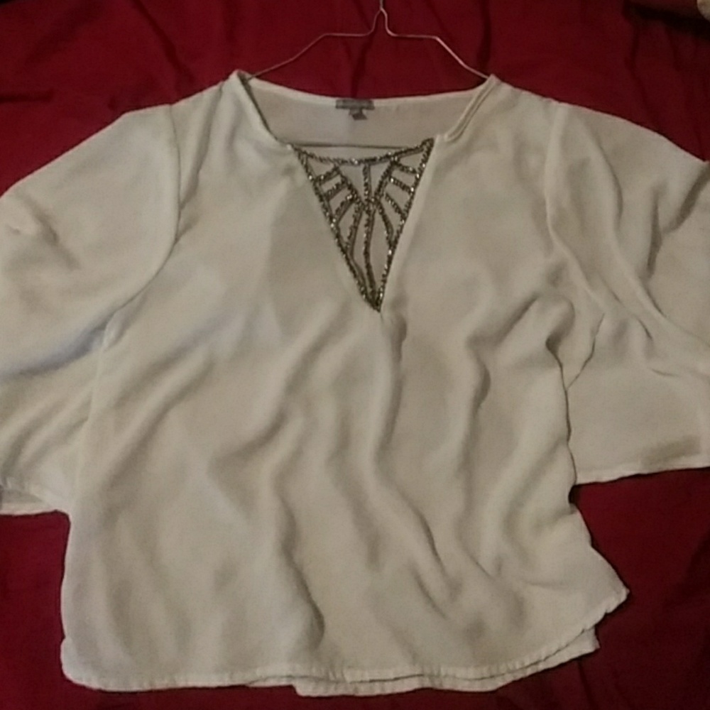 White blouse with rhinestone detail on the front